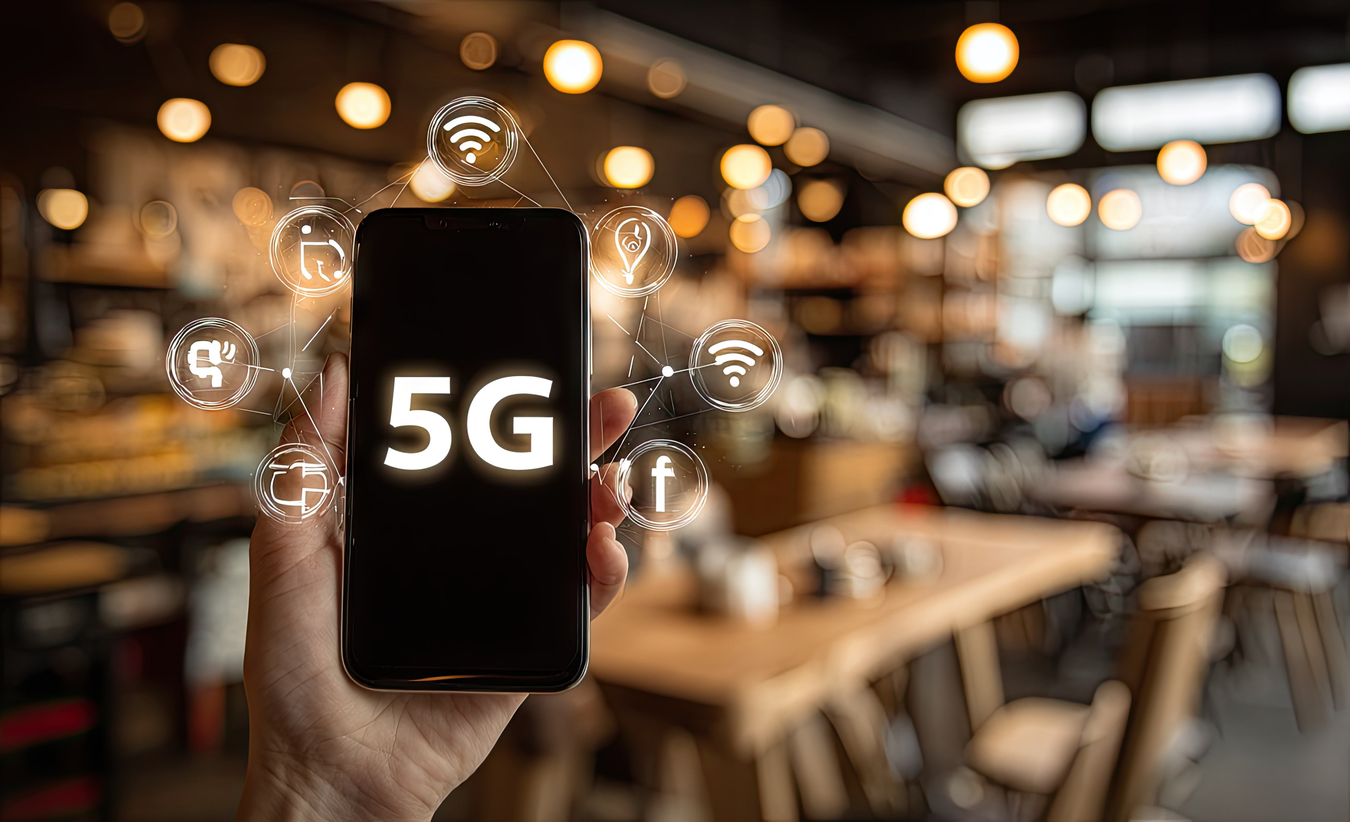 A Hand Holds A Smartphone Showcasing 5g Technology