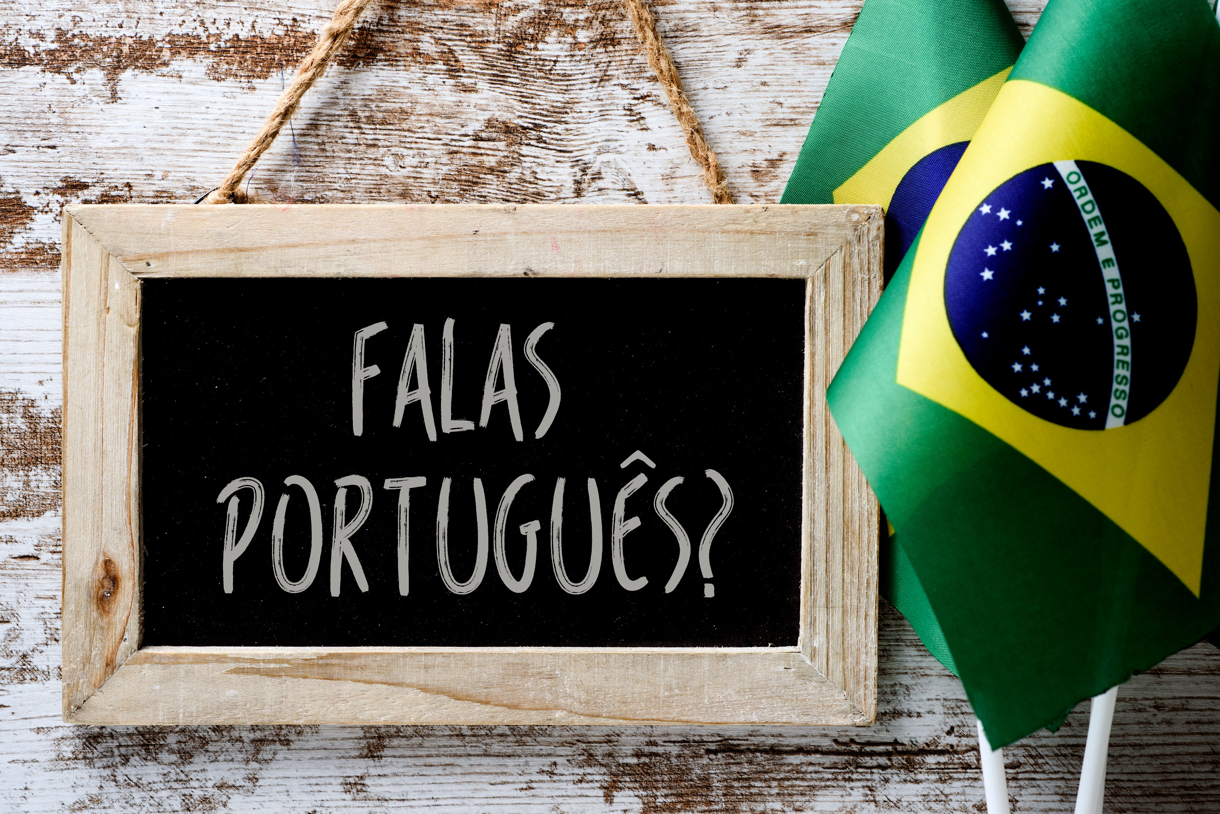 A Wooden Framed Chalkboard With The Question Falas Portuges