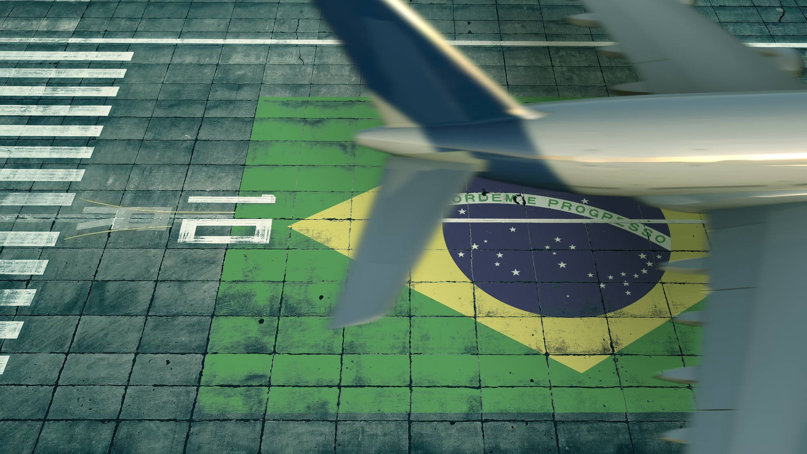 Aerial View Of A Landing Airplane And Flag Of Brazil