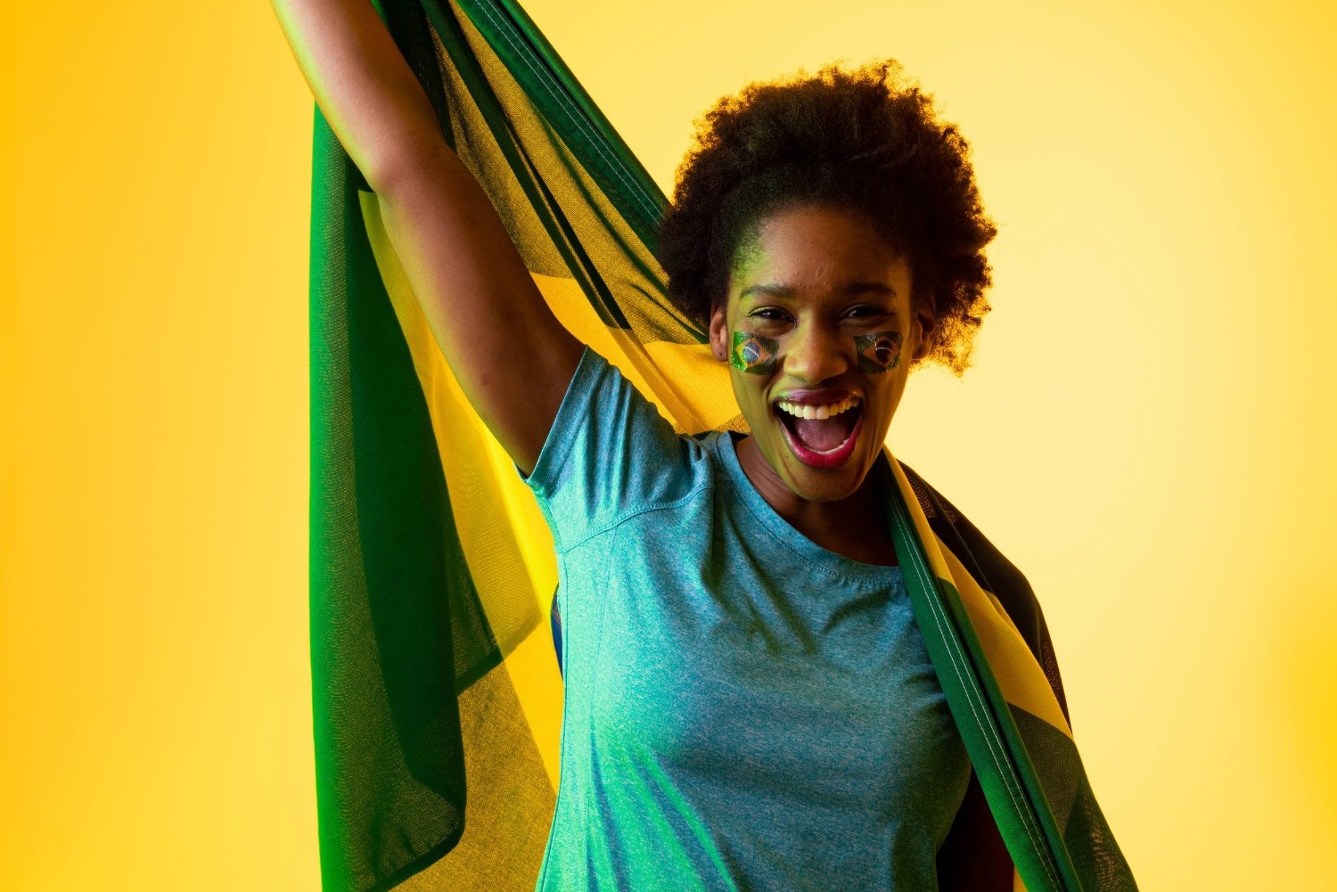 African Holding Up The Flag Of Brazil