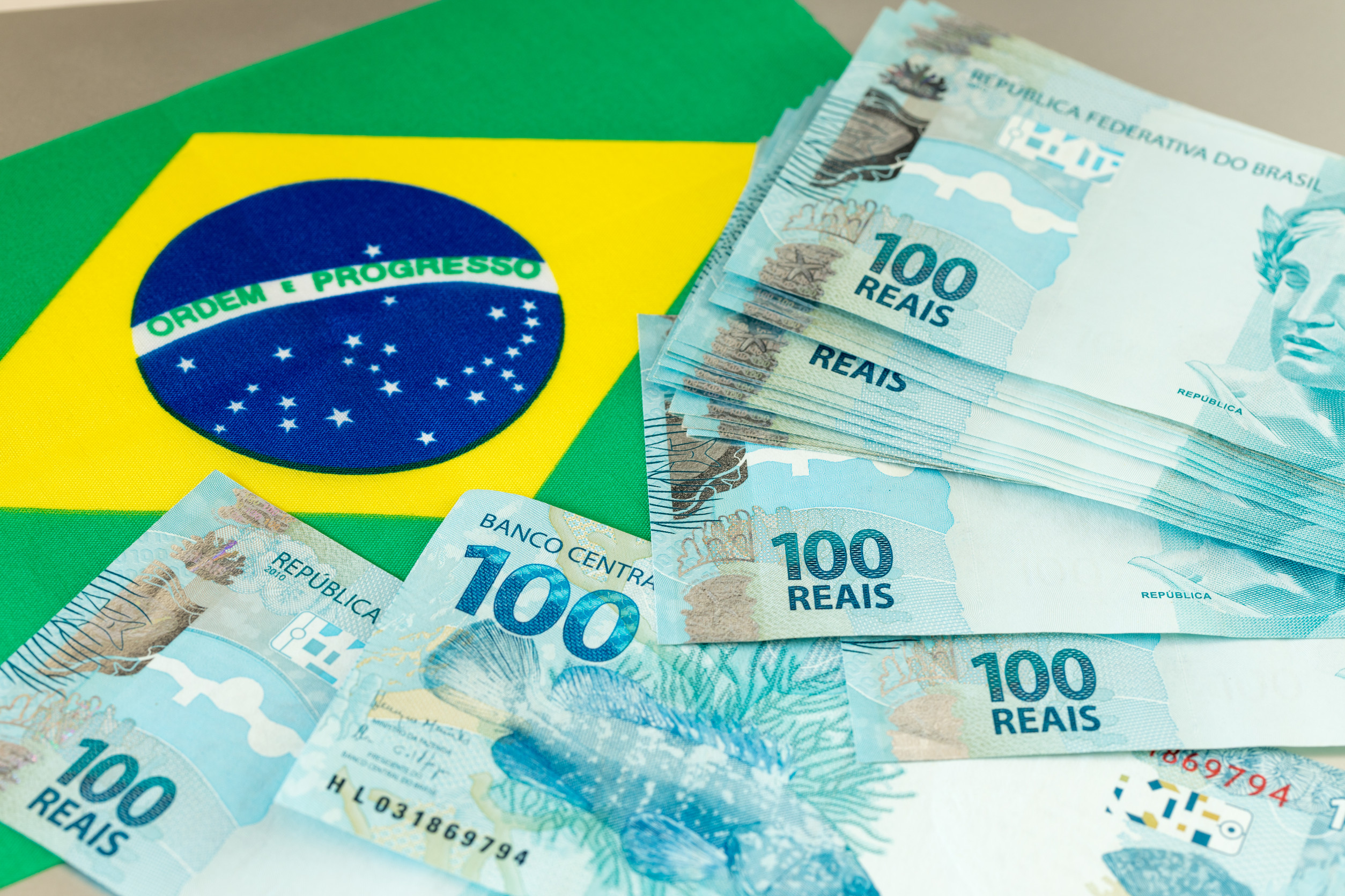 Brazilian Money Banknotes On The Background Of The Flag
