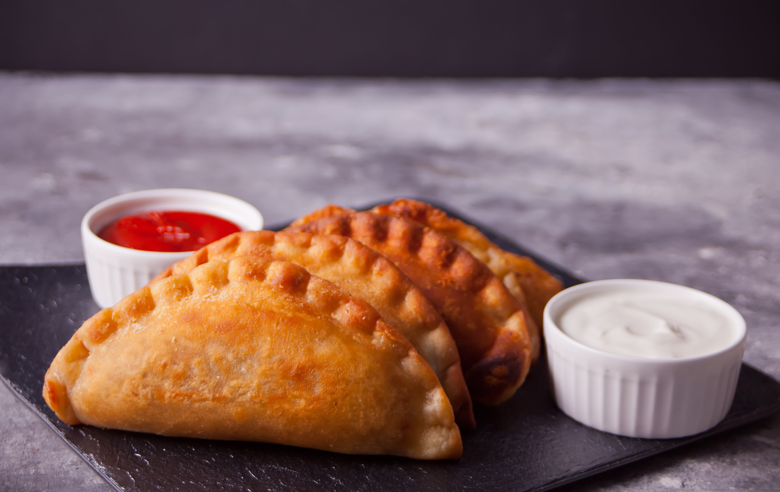 Fied Meat Pies Empanadas Cheburek With Dips On The Black Plate