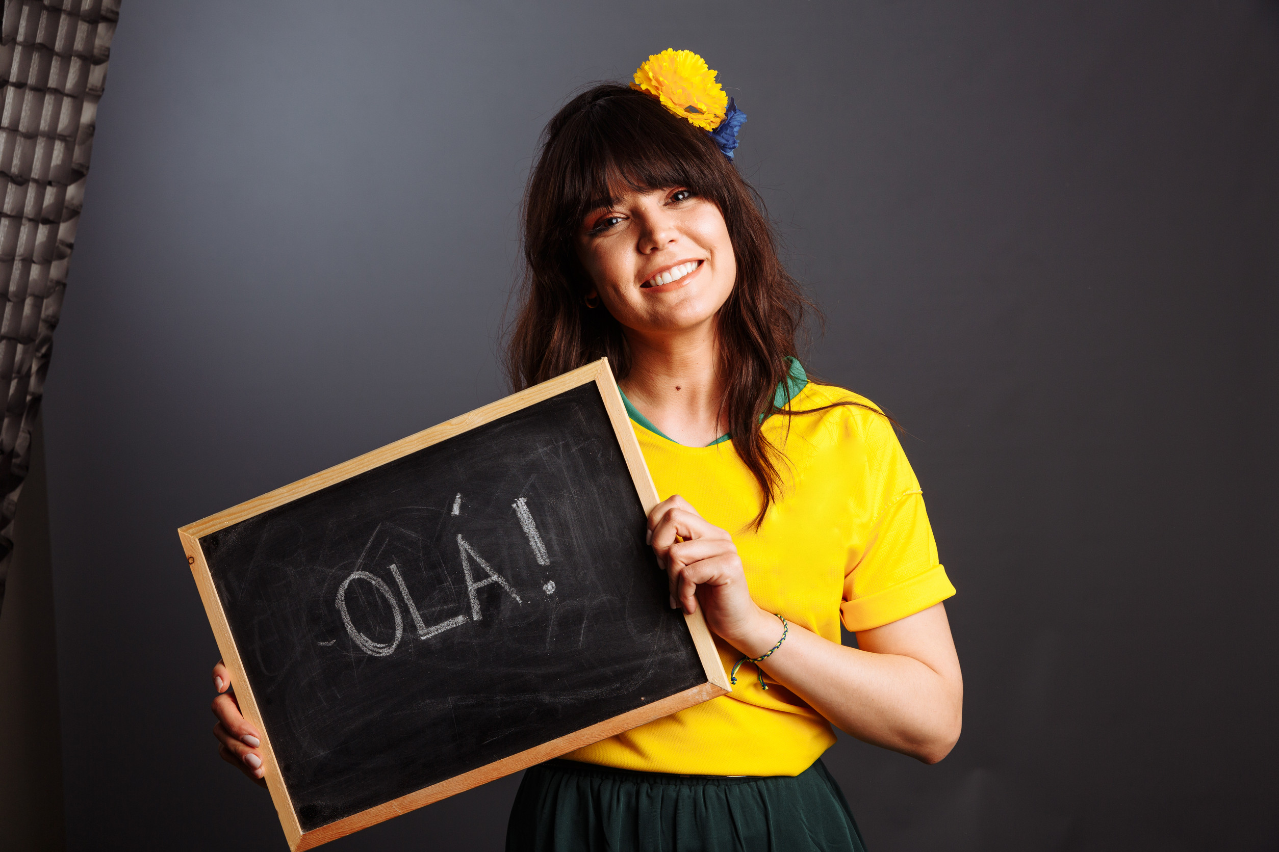 Latin Brazil Lady In A Soccer Clothes Holding A Small Blackboard