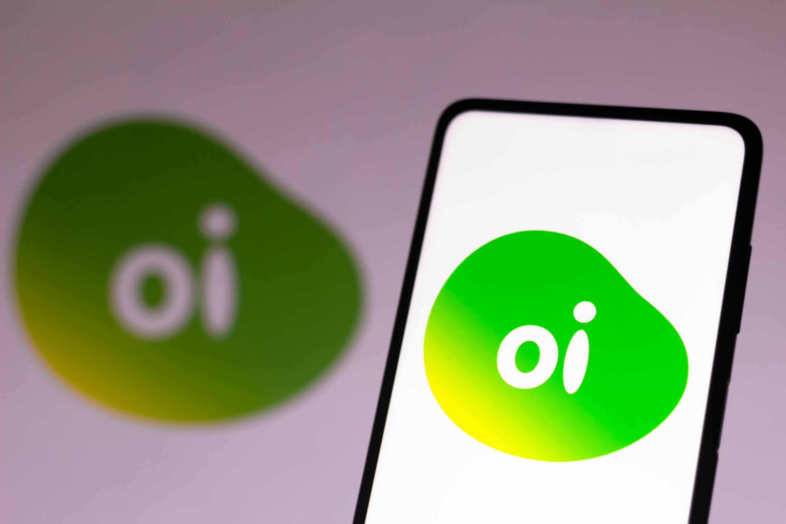 The Oi Logo Is Displayed On A Smartphone