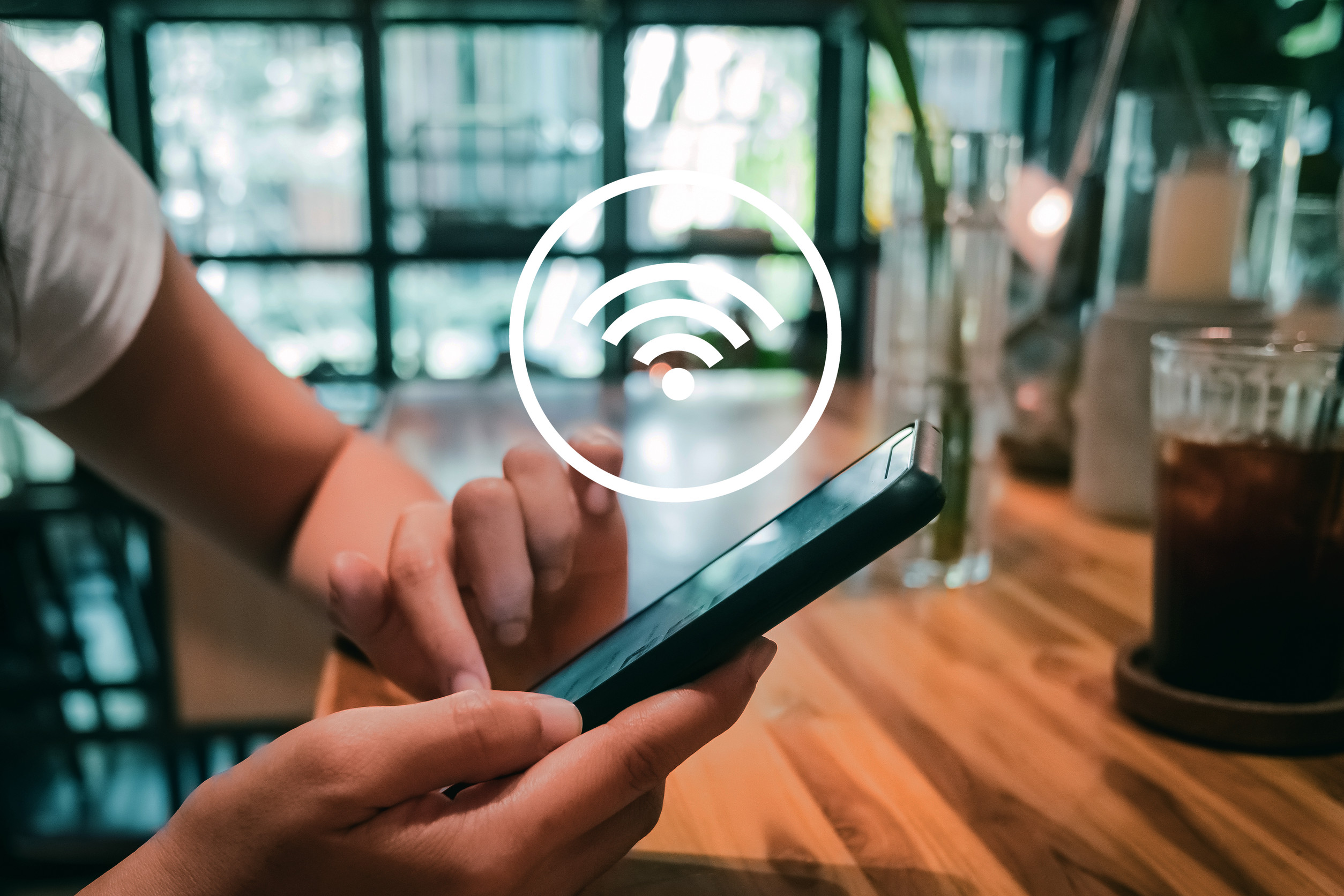 Woman Hand Using A Smartphone With A Wi Fi Icon