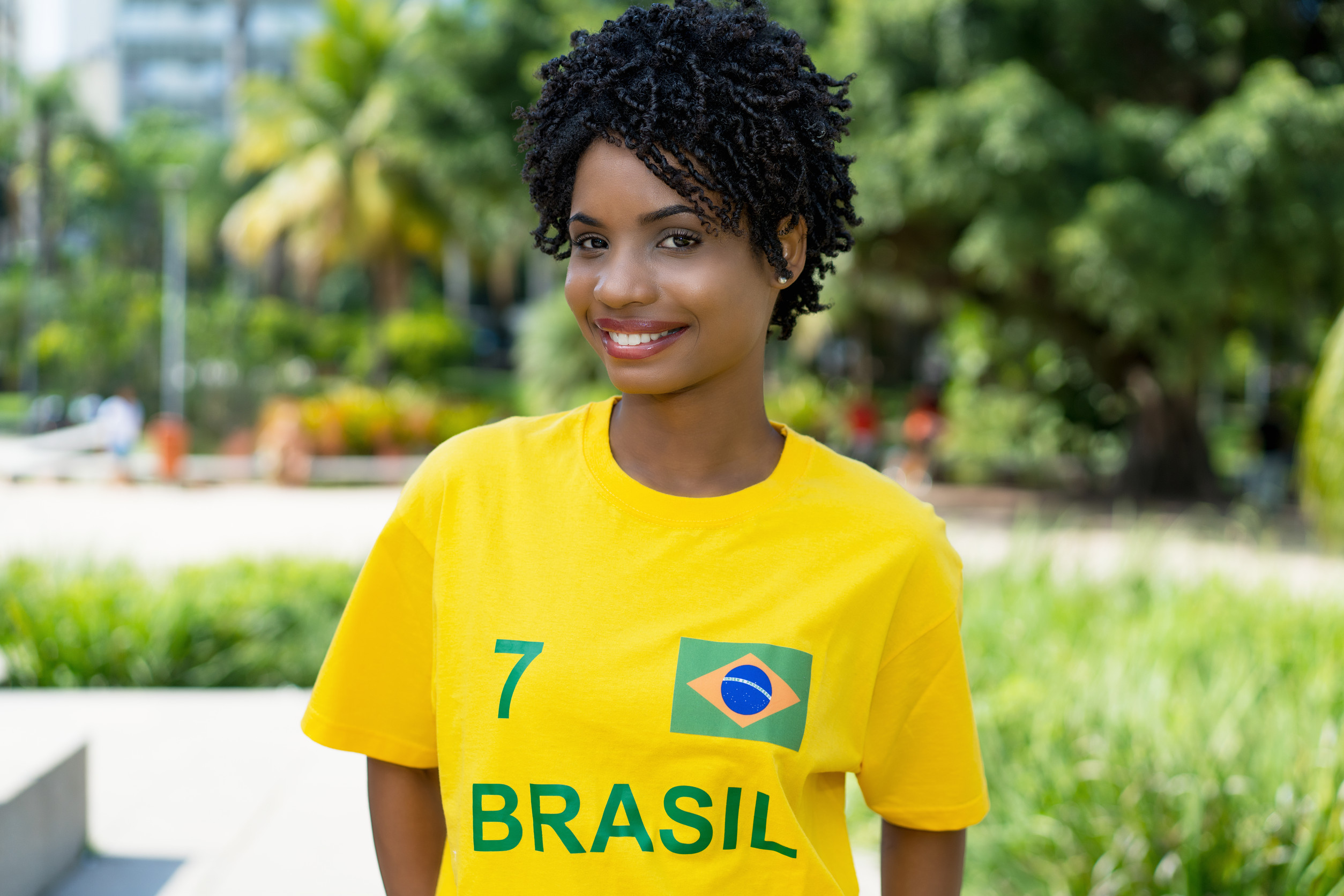 Young Brazilian Female Football Fan With Yellow Jersey Outdoor